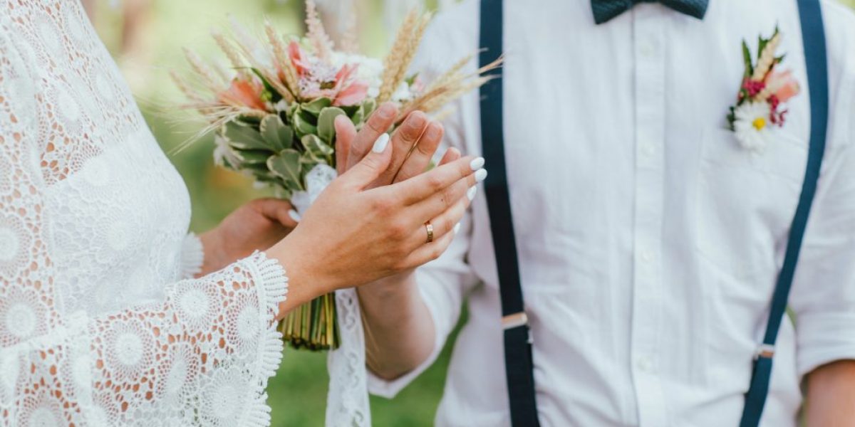 crop-photo-of-bride-young-woman-with-the-boho-style-bouquet-with-groom-on-wedding.jpg